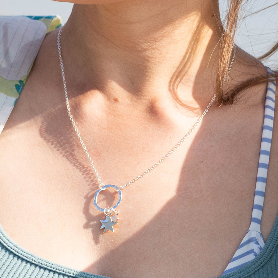 Silver plated necklace with triple stars and hammered hoop