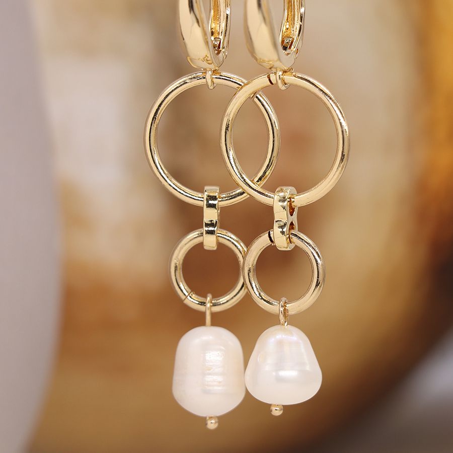 Golden double hoop and pearl drop earrings