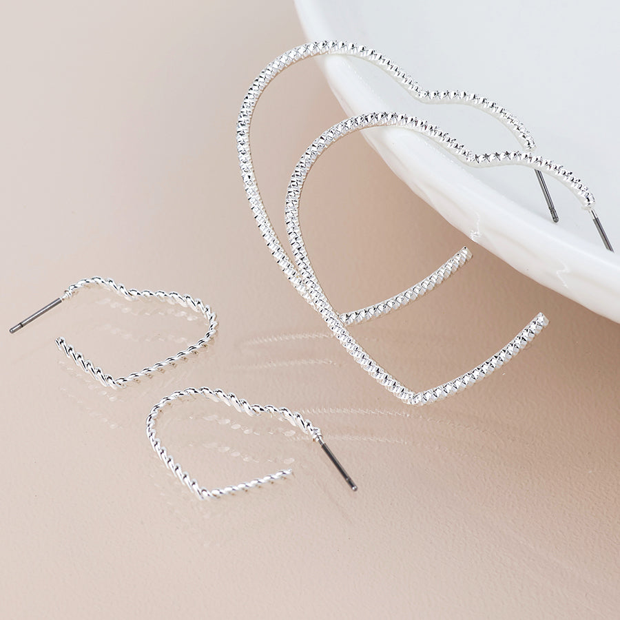 Silver plated mixed size textured heart earrings