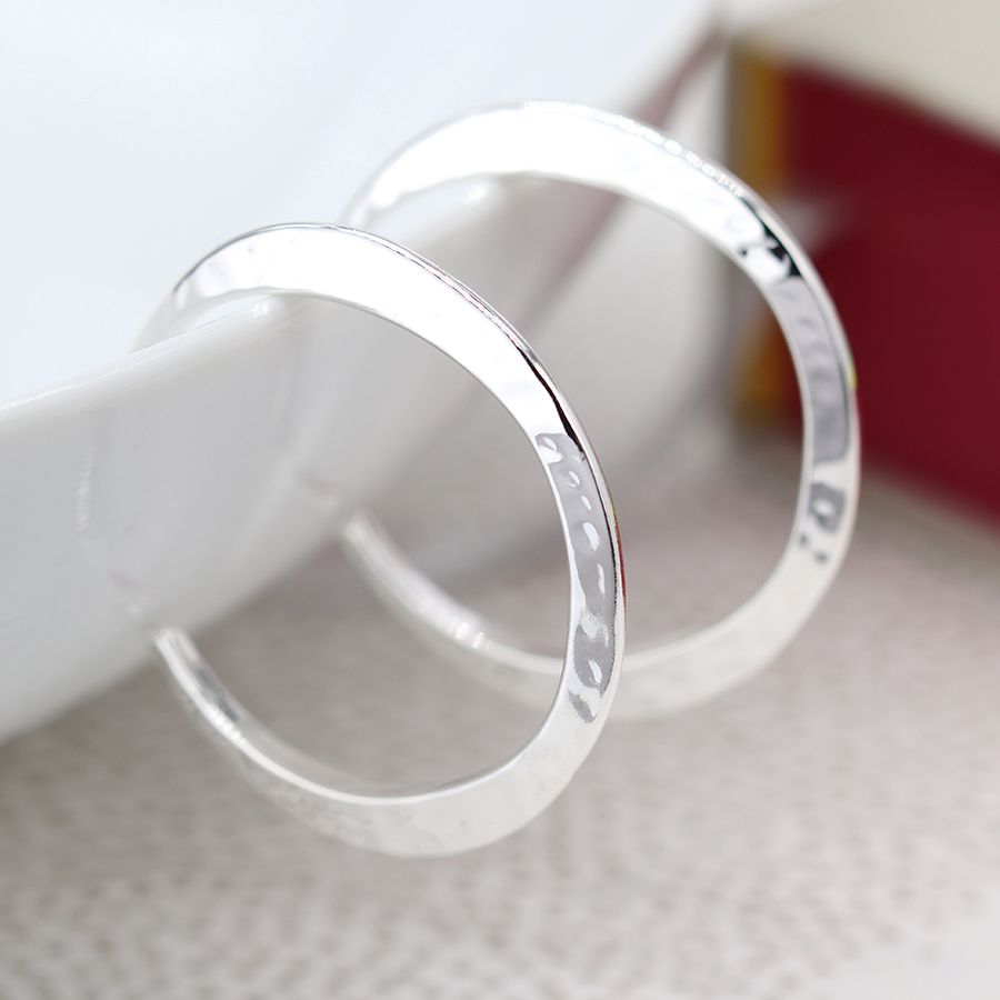 Silver plated irregular hammered open hoop earrings