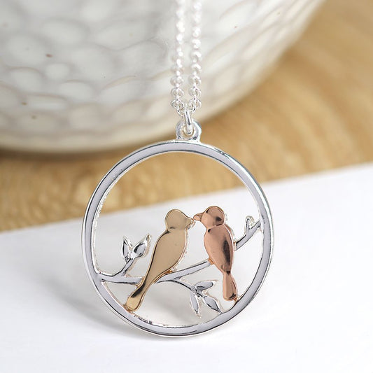 Silver plated mixed finish lovebirds in circle necklace
