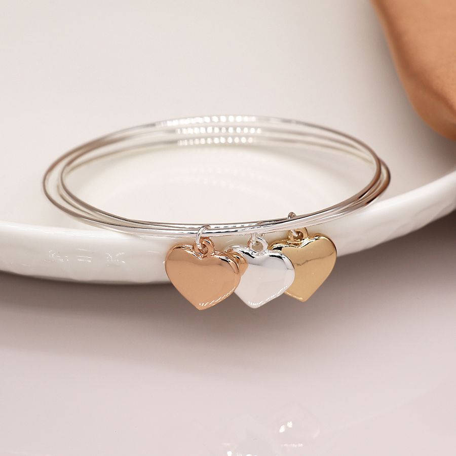 Silver plated triple bangle with large mixed metallic hearts