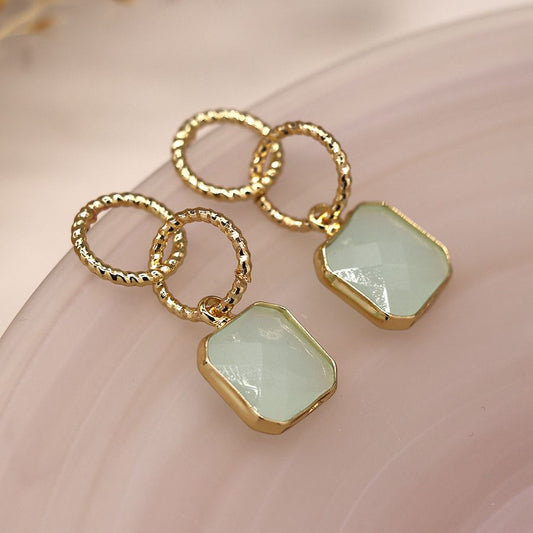 Golden textured hoops and aqua stone earrings