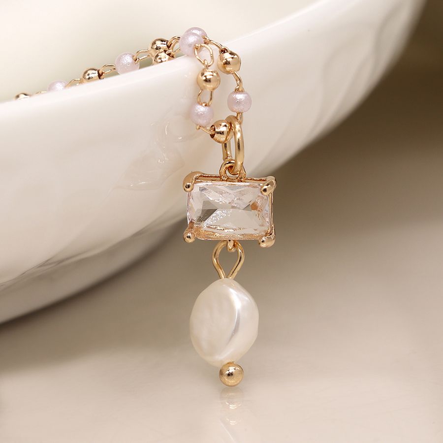 Golden bead and pearl necklace with crystal and pearl drop