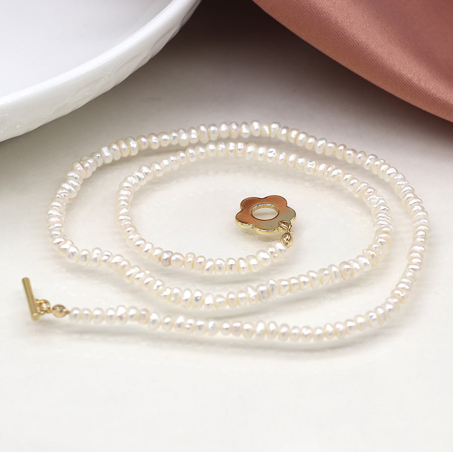 Ivory freshwater pearl and golden retro flower clasp necklace