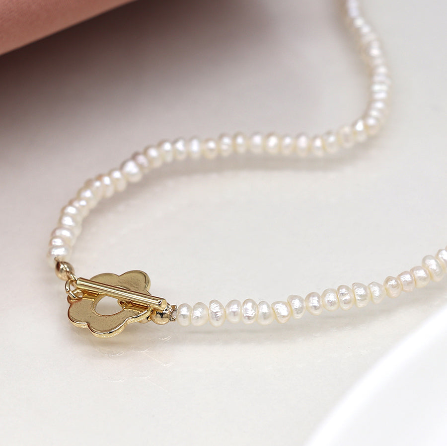 Ivory freshwater pearl and golden retro flower clasp necklace