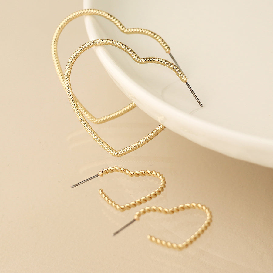 Golden mixed size textured heart earrings