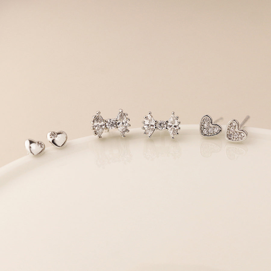 Silver plated bows and hearts triple stud earring set
