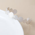 Silver plated dappled disc bangle