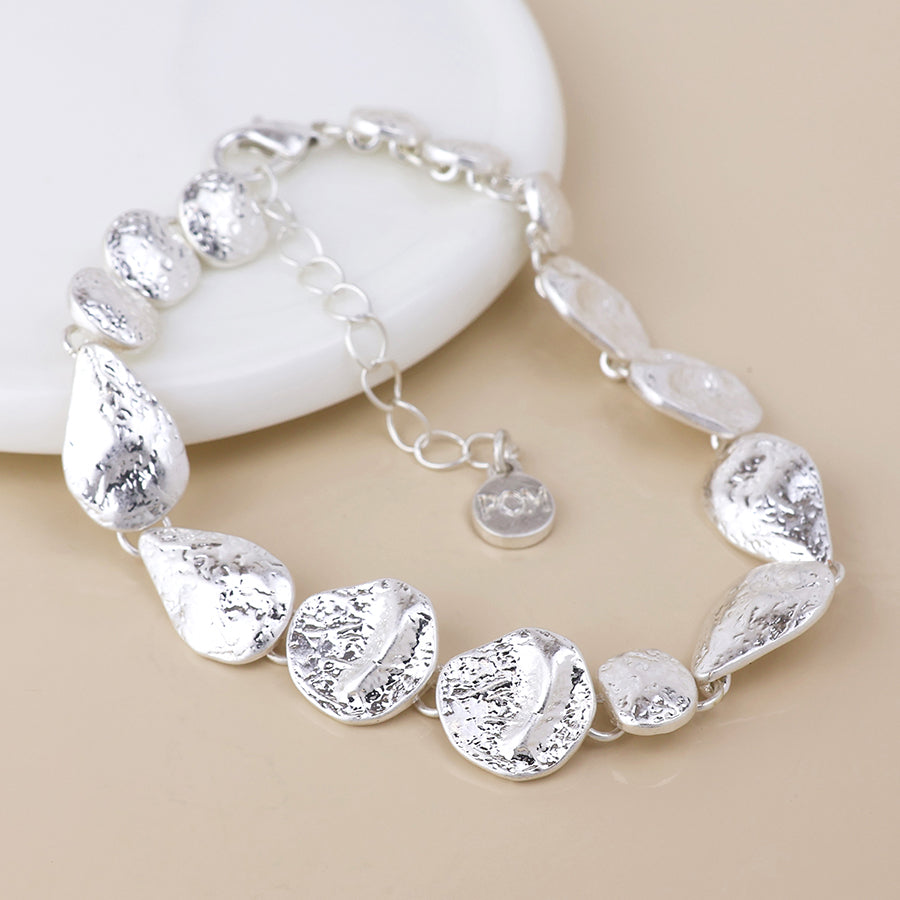 Molten silver plated molten organic worn drops bracelet