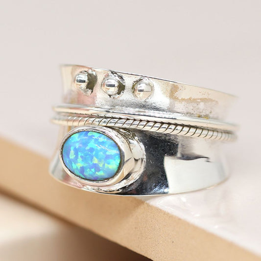 Sterling silver triple dot detail spinning ring with opal