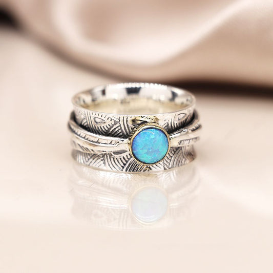 Sterling silver embossed spinning ring with leaf band and opal