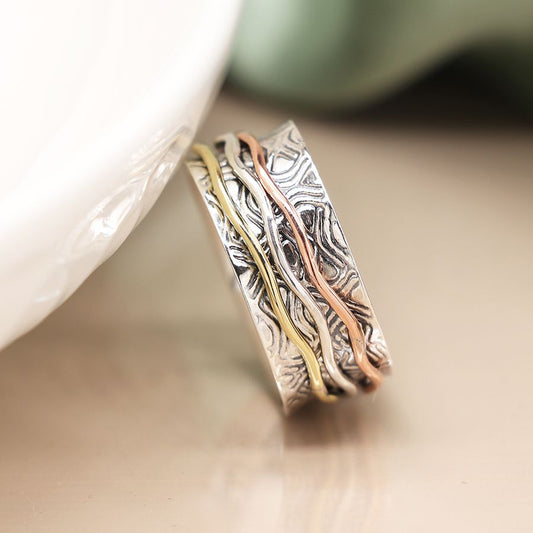 Sterling silver embossed spinning ring with triple wave band
