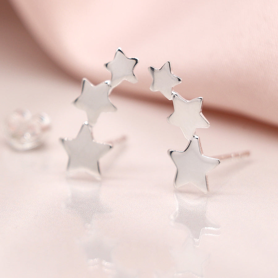 Sterling silver row of stars stud earrings