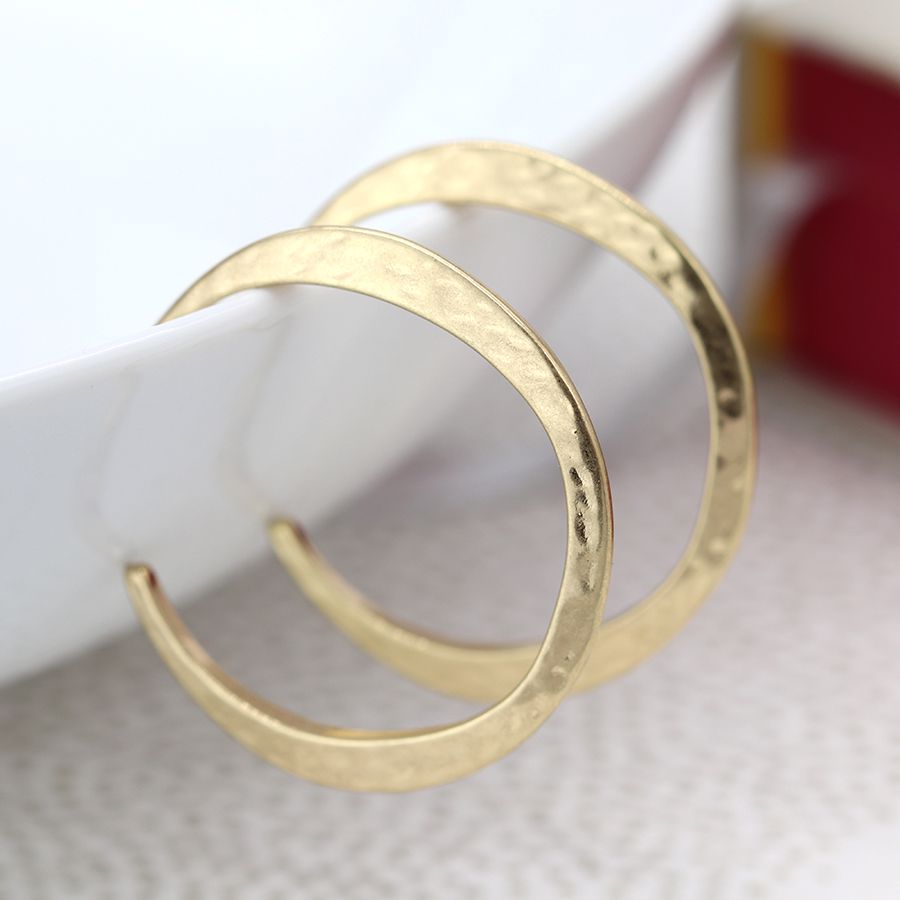 Worn gold irregular hammered open hoop earrings